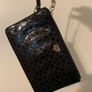 Coach signature embossed wristlet in Black